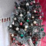 We decorated the Christmas tree with tinsels and baubles.